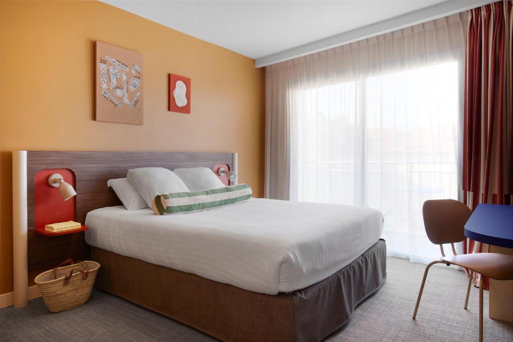 Postel nebo postele na pokoji v ubytování Hotel Abrial