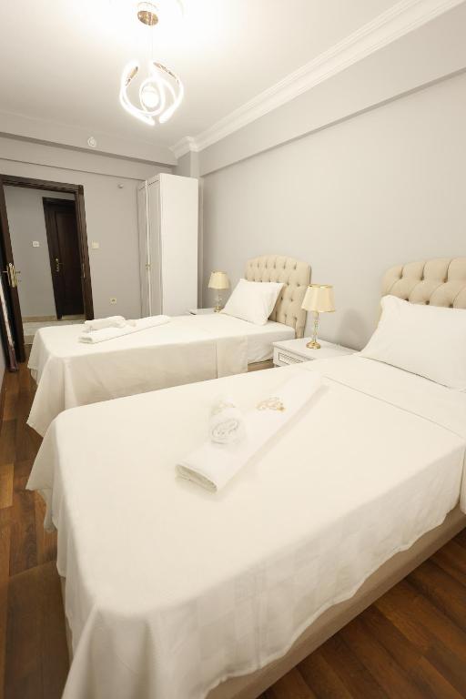 Postel nebo postele na pokoji v ubytování Golden Homes