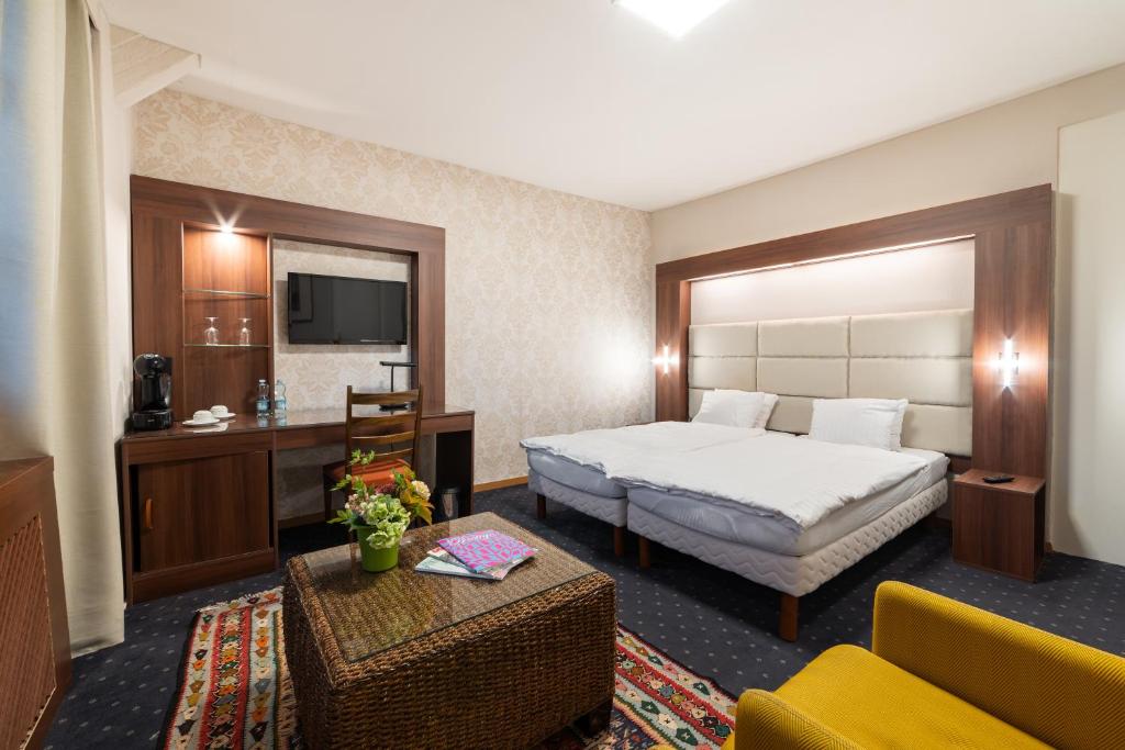 Postel nebo postele na pokoji v ubytování Hotel Restaurant Kutchi