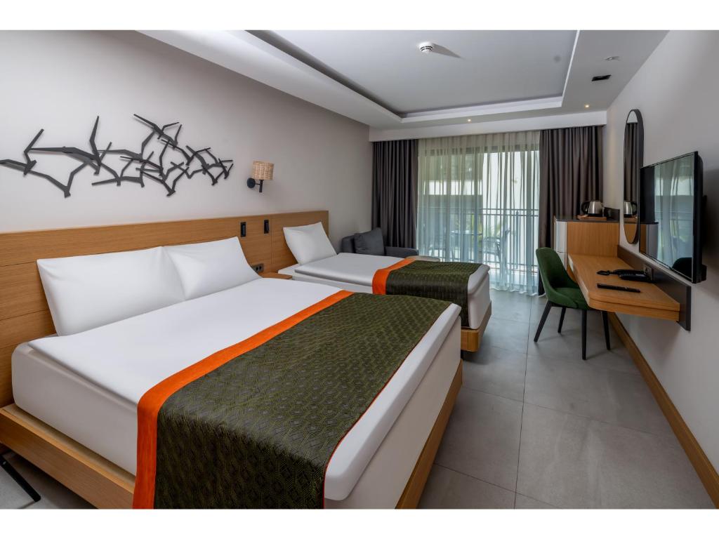 Postel nebo postele na pokoji v ubytování Swandor Hotels & Resorts - Kemer