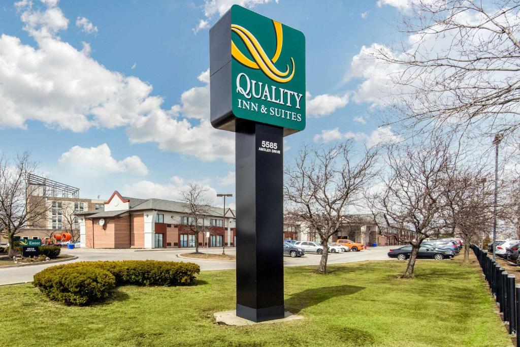 a sign for a quality law and justice at Quality Inn & Suites in Mississauga