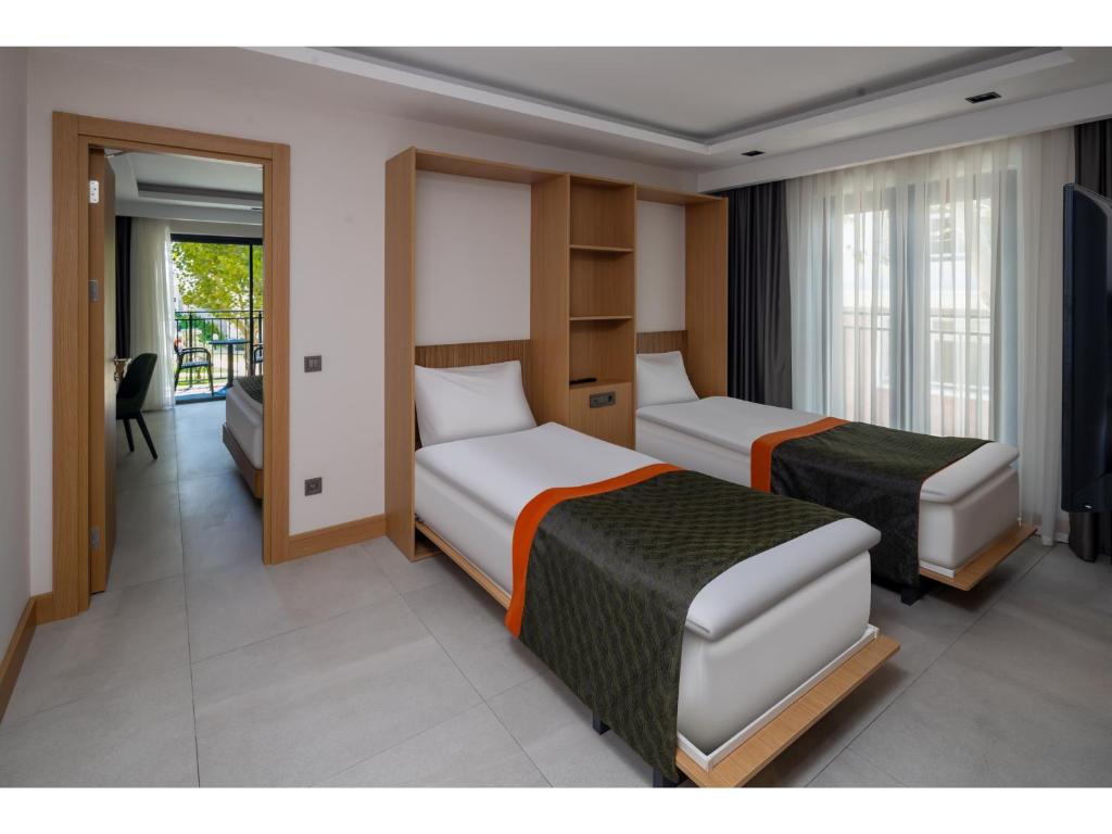 Postel nebo postele na pokoji v ubytování Swandor Hotels & Resorts - Kemer