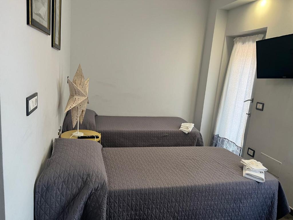 Postel nebo postele na pokoji v ubytování B&B La Torre