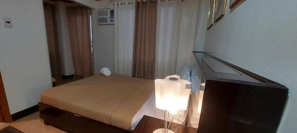 Postel nebo postele na pokoji v ubytování ISLAND VIEW SUITES