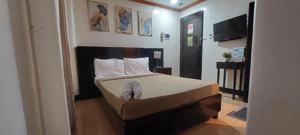 Kama o mga kama sa kuwarto sa ISLAND VIEW SUITES