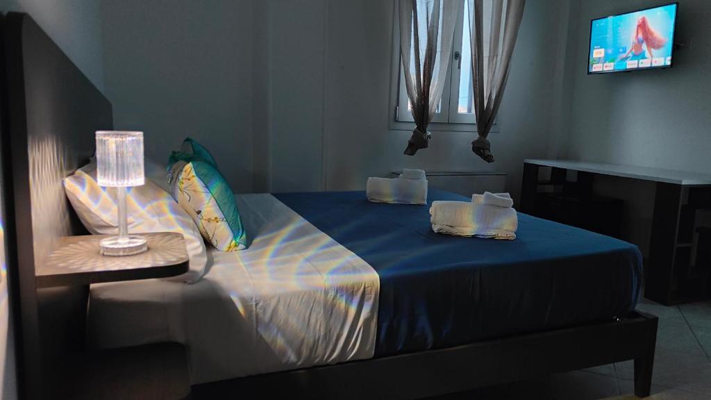 Postel nebo postele na pokoji v ubytování Helianthus Rooms