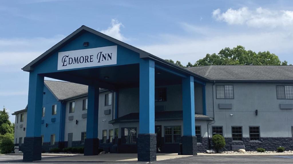 a building with a sign that reads anchorage inn at Edmore Inn in Edmore