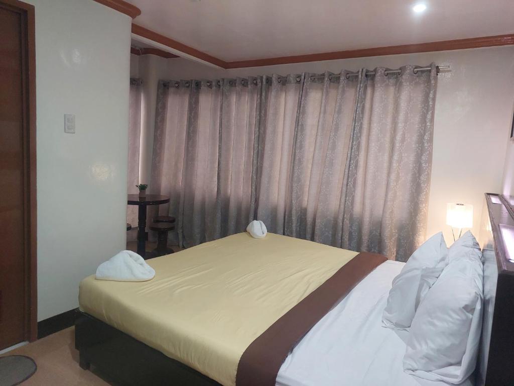 Postel nebo postele na pokoji v ubytování ISLAND VIEW SUITES