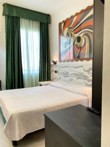 Postel nebo postele na pokoji v ubytování Hotel Europa