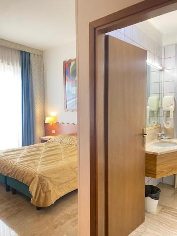 Postel nebo postele na pokoji v ubytování Hotel Europa