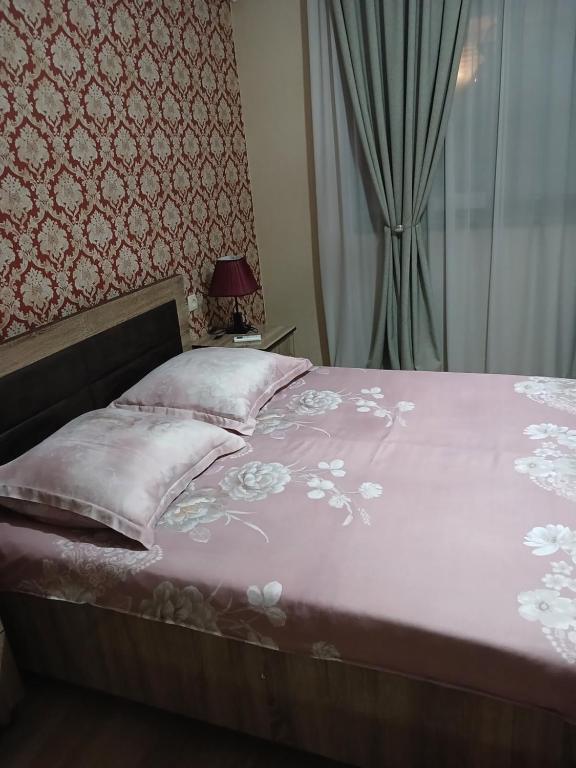 Postel nebo postele na pokoji v ubytování MANGO Guesthouse