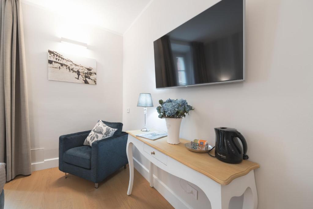 TV a/nebo společenská místnost v ubytování Rivalago B&B