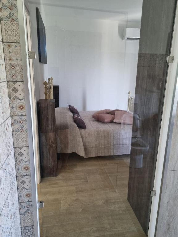 Postel nebo postele na pokoji v ubytování LA PACE DEGLI AGRUMI