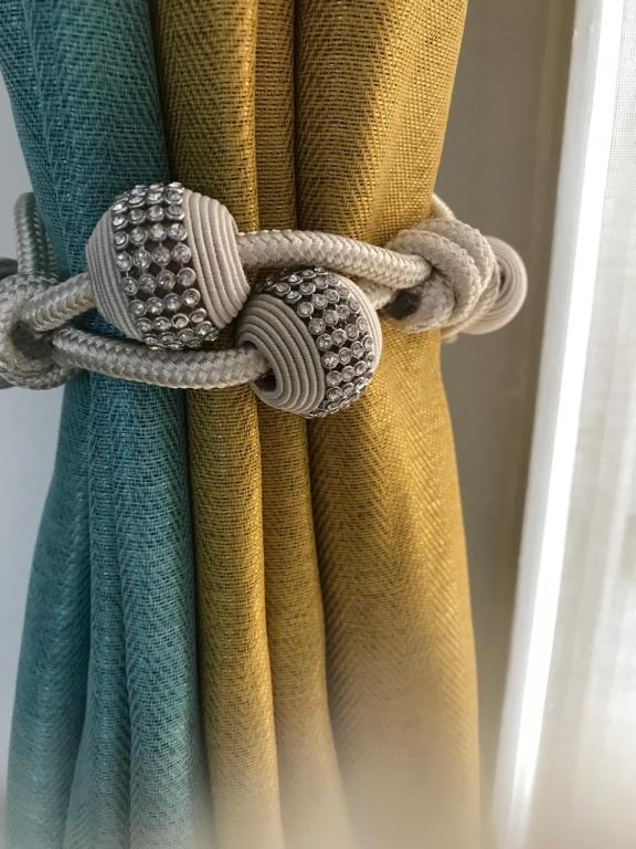 a close up of a curtain with a rope at The Havens hideaway in Freeport