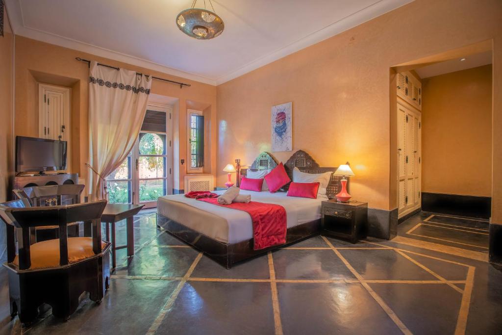 Postel nebo postele na pokoji v ubytování Janat Al Atlas Resort & Spa