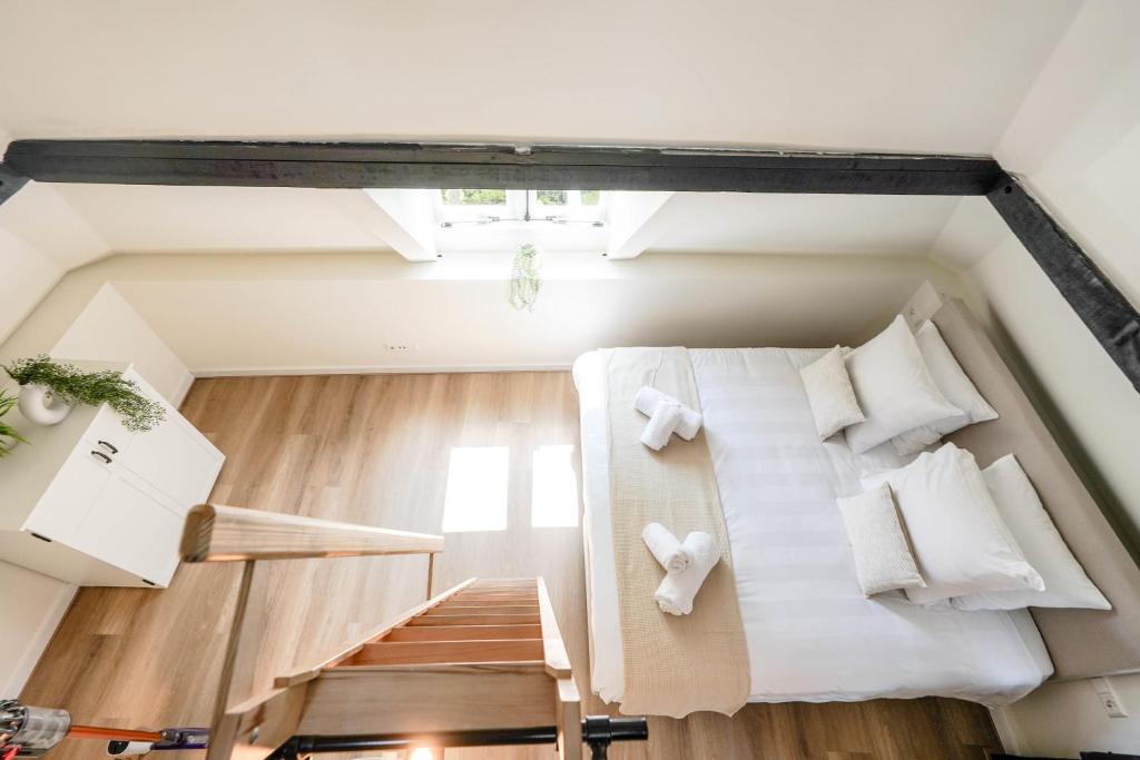 Postel nebo postele na pokoji v ubytování Beautiful Apartment With Loft