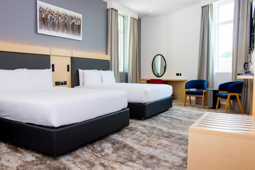 Postel nebo postele na pokoji v ubytování Holiday Inn Express Dubai Airport by IHG