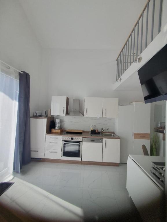 Kuchyň nebo kuchyňský kout v ubytování Rhön Apartments