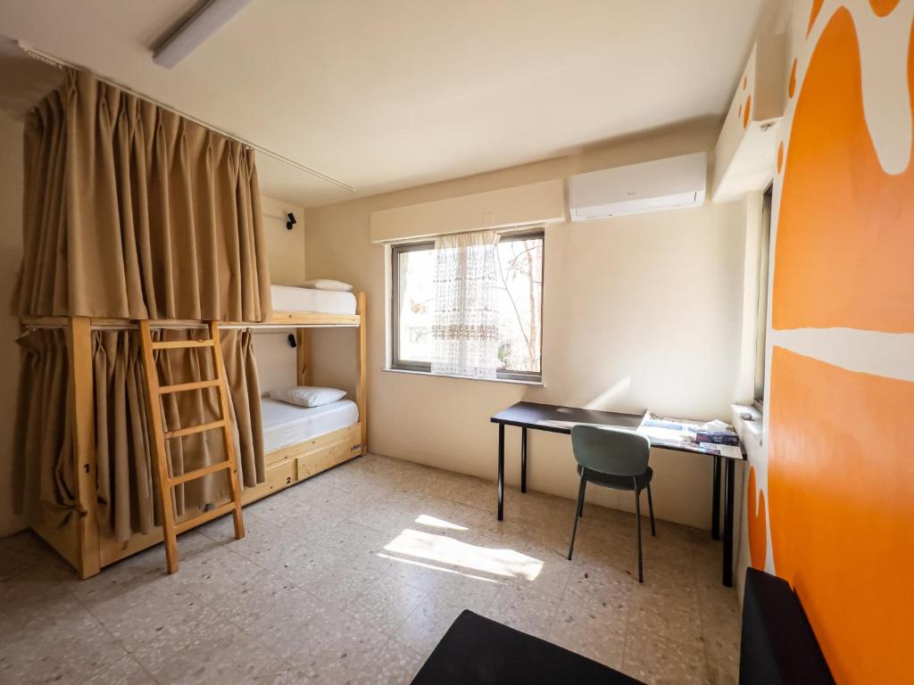 Postel nebo postele na pokoji v ubytování Battuta Hostel