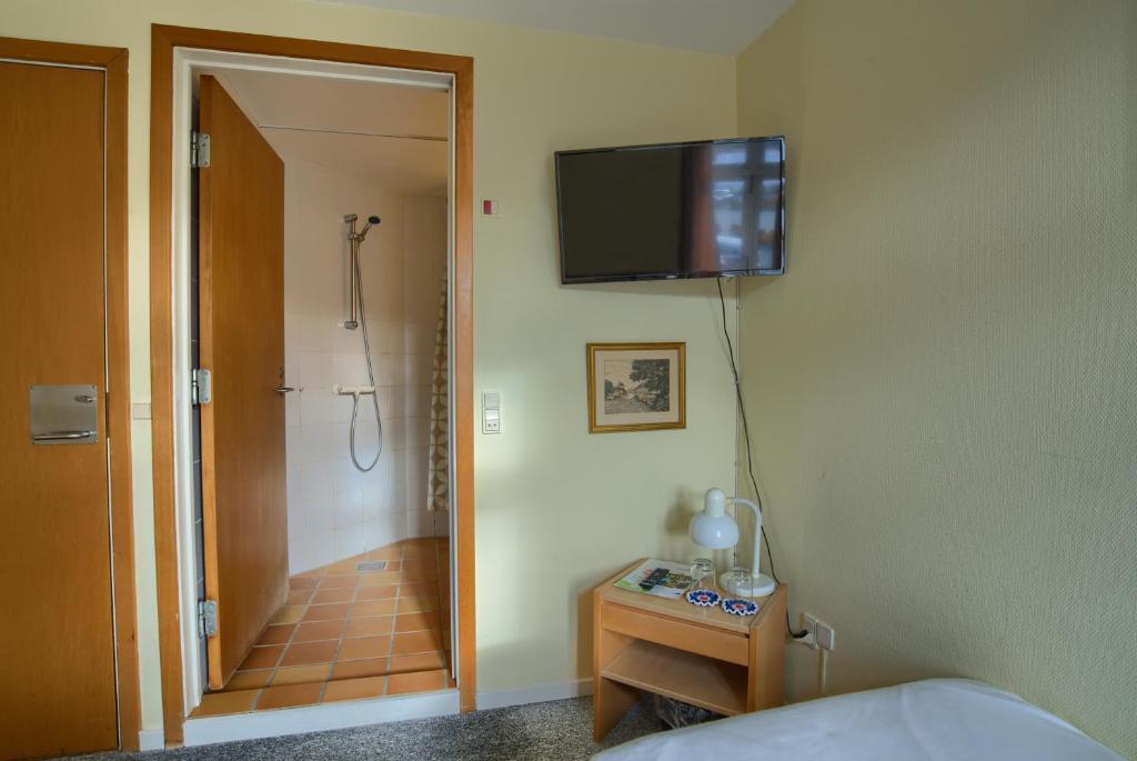 TV a/nebo společenská místnost v ubytování Ebsens Hotel