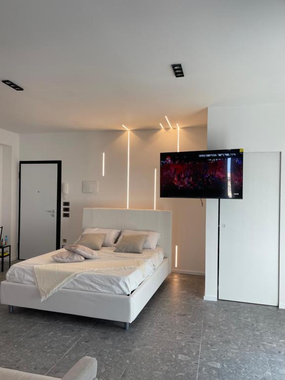 Casa Mare Design tesisinde bir odada yatak veya yataklar