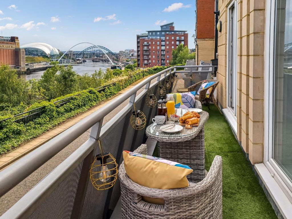 a balcony with two tables and chairs on a building at The Hive in Newcastle upon Tyne