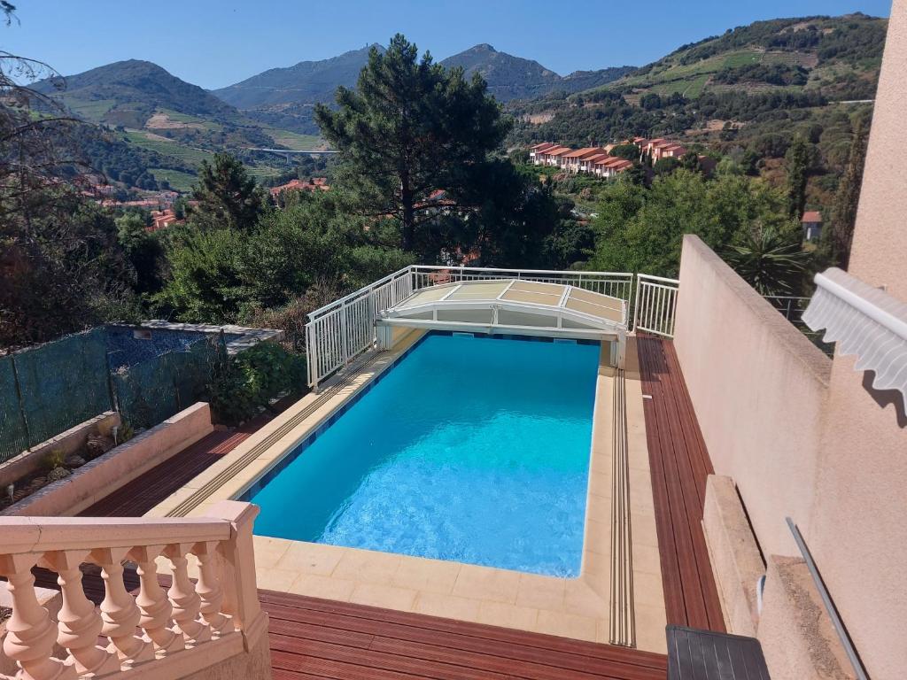 a swimming pool on a balcony of a house at Sur les hauteurs de Collioure in Collioure