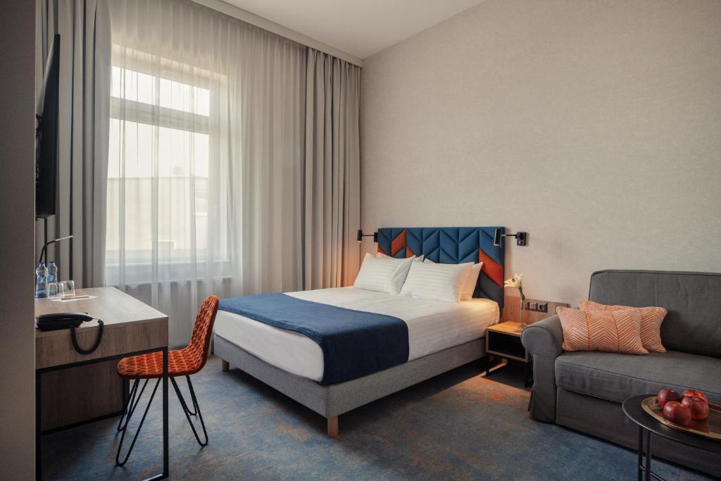 Postel nebo postele na pokoji v ubytování Hotel Faros Gdansk Airport