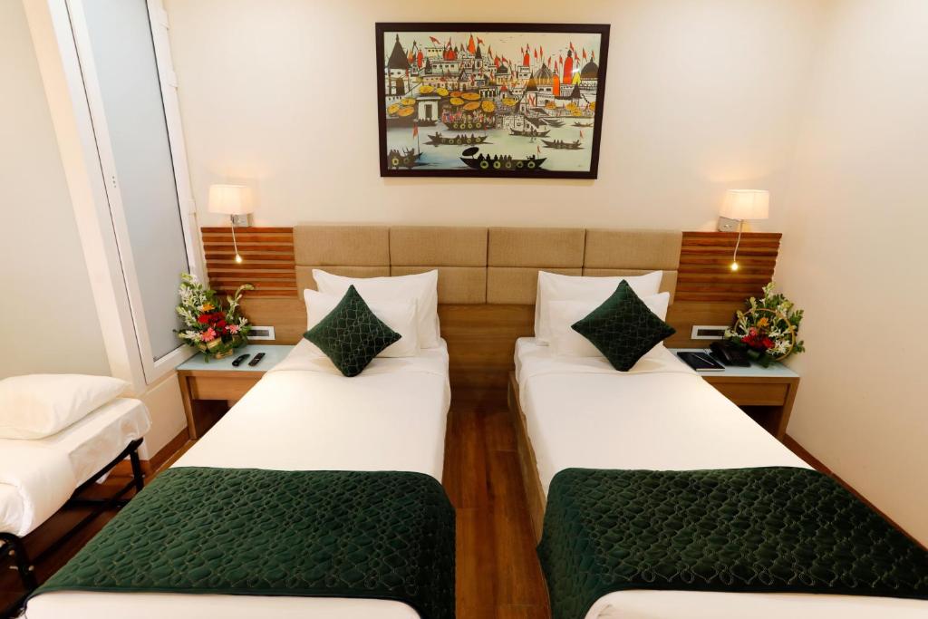 Postel nebo postele na pokoji v ubytování Hotel Dolphin Grand
