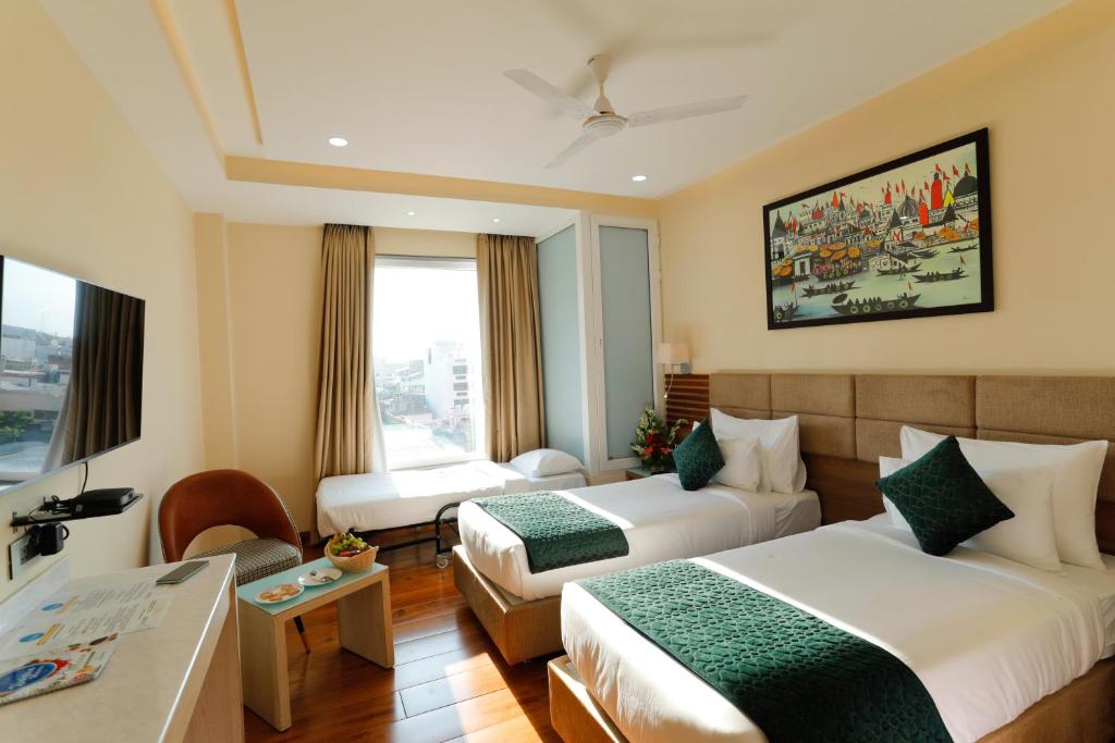 Postel nebo postele na pokoji v ubytování Hotel Dolphin Grand