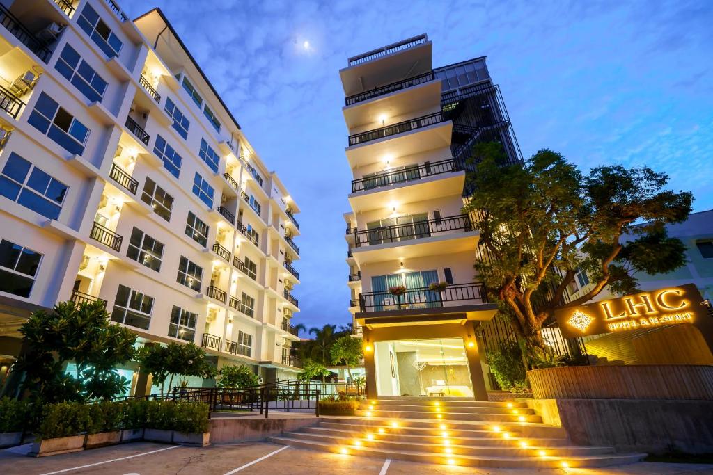 a building with lights in front of it at LHC HOTEL AND RESORT in Pattaya Central