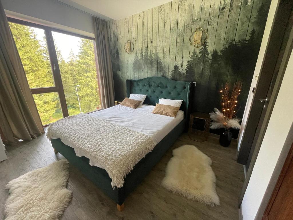 מיטה או מיטות בחדר ב-Luxury Silver Mountain Apartment