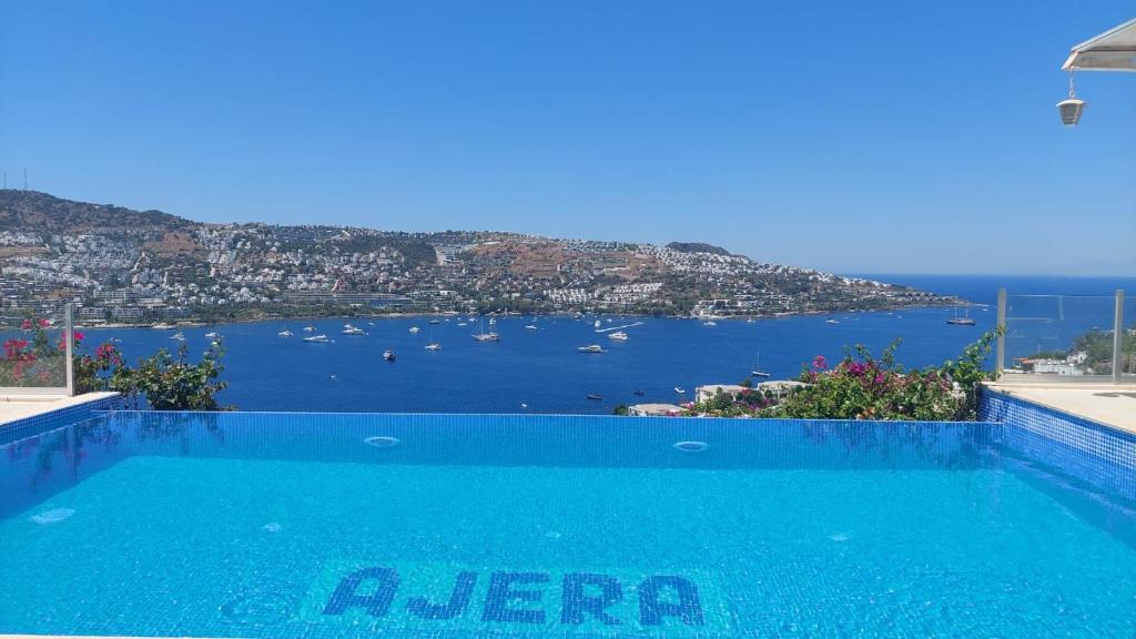 a swimming pool with a view of the ocean at MAGNIFICENT VIEW with Private Pool & Piano, 3 Bedroom Villa, MIN 4 nigths in Gundogan