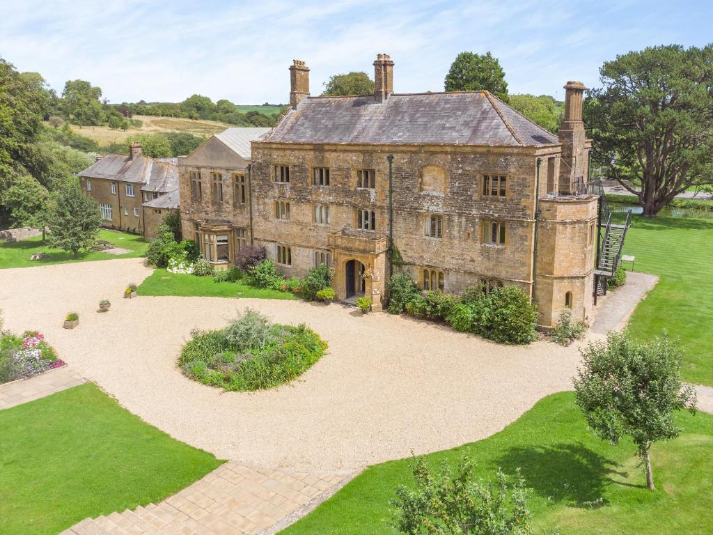an aerial view of an old house with a garden at Hooke Court in Hooke