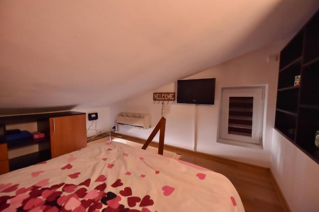a bedroom with a bed with hearts on it at Anne Apartament in Năvodari