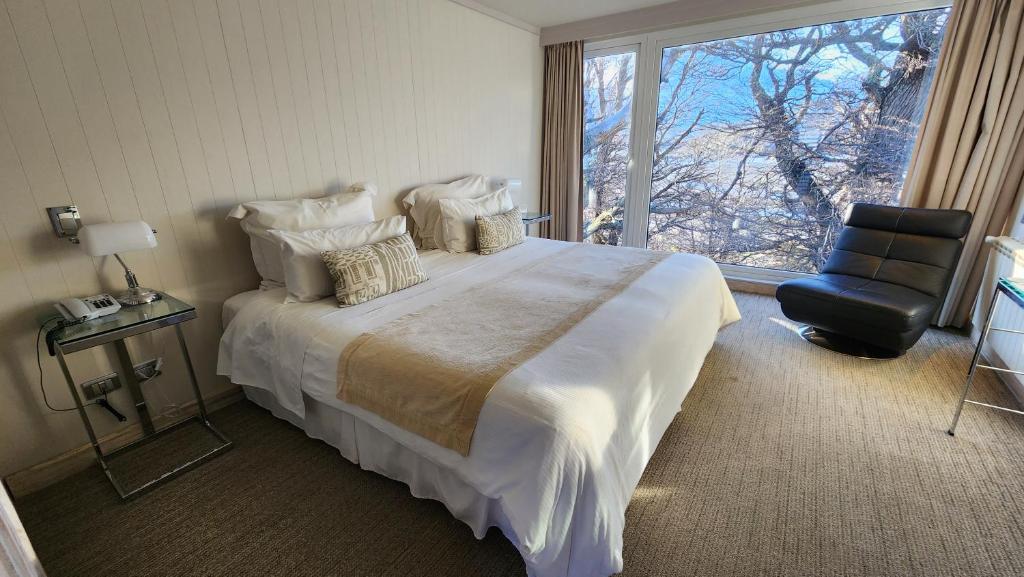 Postel nebo postele na pokoji v ubytování Hotel Lago Grey