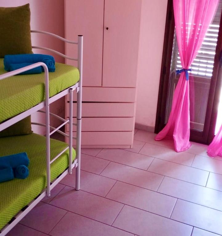 A bed or beds in a room at DGS APARTHOTEL