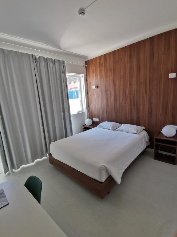 Postel nebo postele na pokoji v ubytování Next Inn