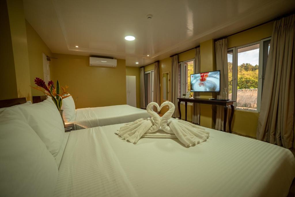 TV a/nebo společenská místnost v ubytování Bernardo's Lantia Hotel