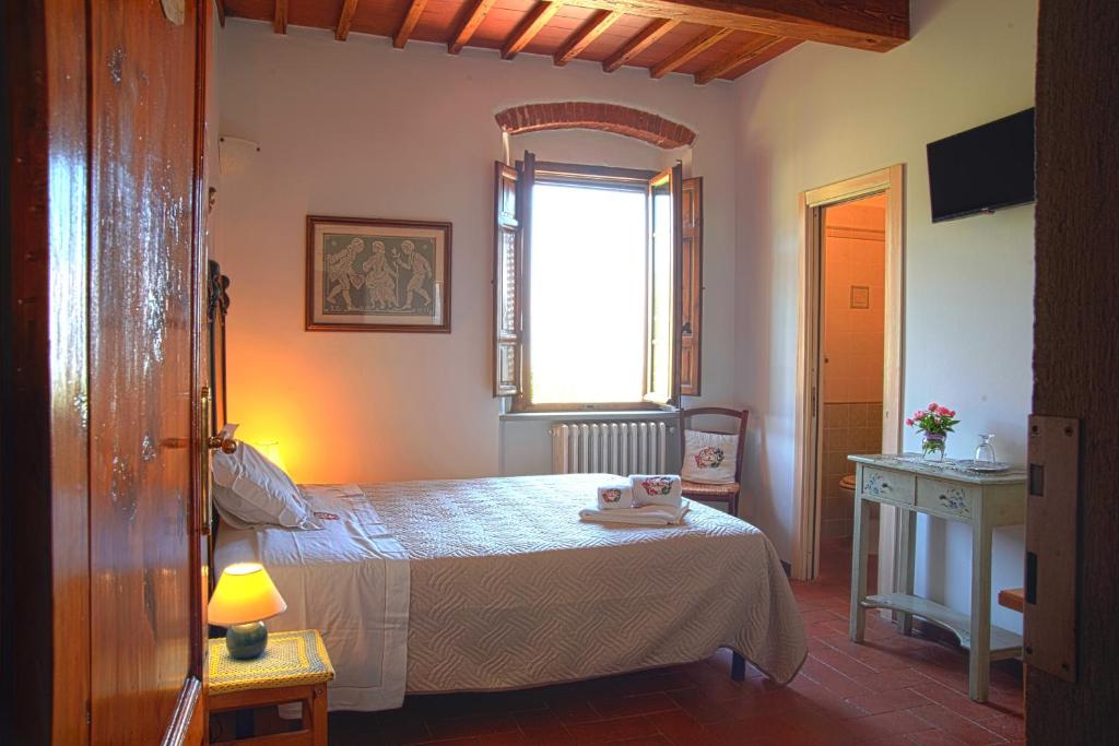 Postel nebo postele na pokoji v ubytování Agriturismo Il Calesse
