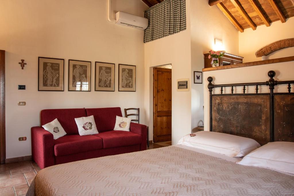 Postel nebo postele na pokoji v ubytování Agriturismo Il Calesse