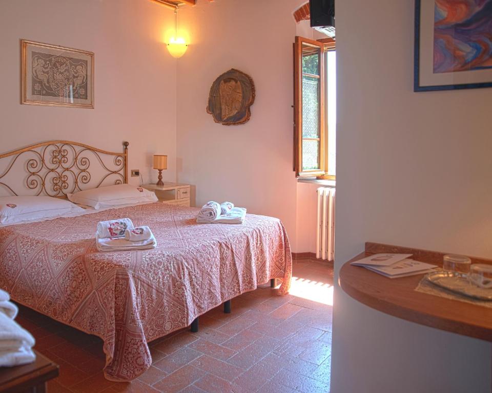 Postel nebo postele na pokoji v ubytování Agriturismo Il Calesse