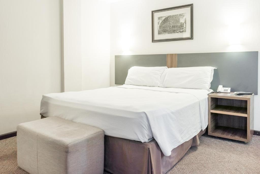 Postel nebo postele na pokoji v ubytování Lancaster Hotel by Castelo Itaipava