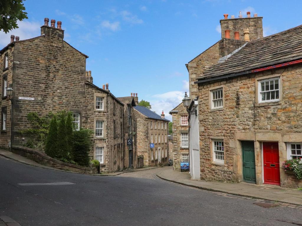 an empty street in an old town with brick buildings at 5 Castle Hill in Lancaster