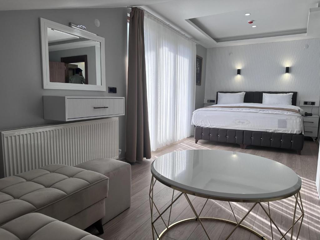 Кровать или кровати в номере Beyaz Köşk Hotel & Cafe