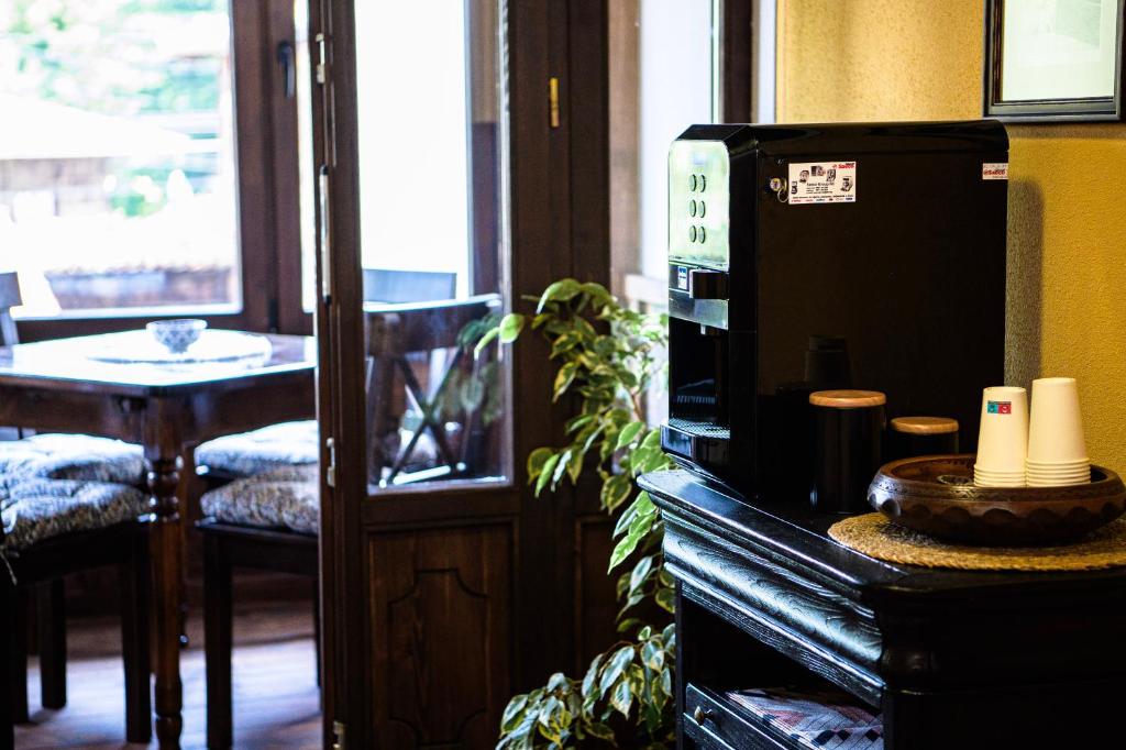 a microwave sitting on top of a table in a room at Къща ЕТНО in Koprivshtitsa