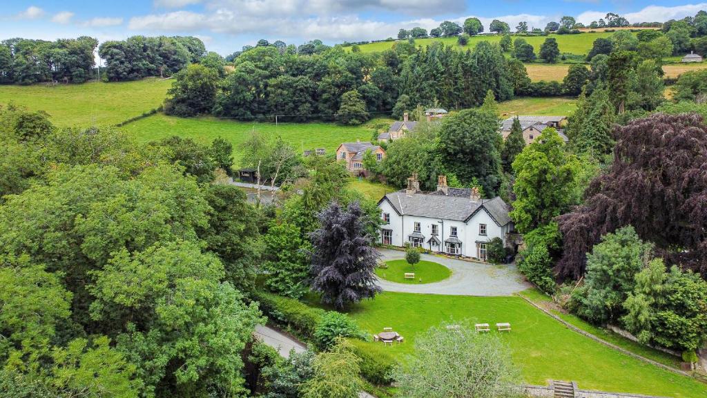 an aerial view of a house in the middle of a field at Brookside Manor House in Chirk