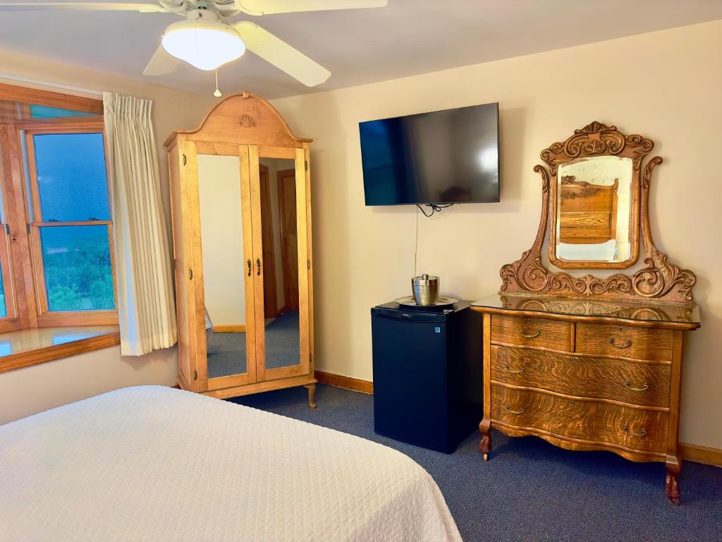 Postel nebo postele na pokoji v ubytování Rose Farm Inn