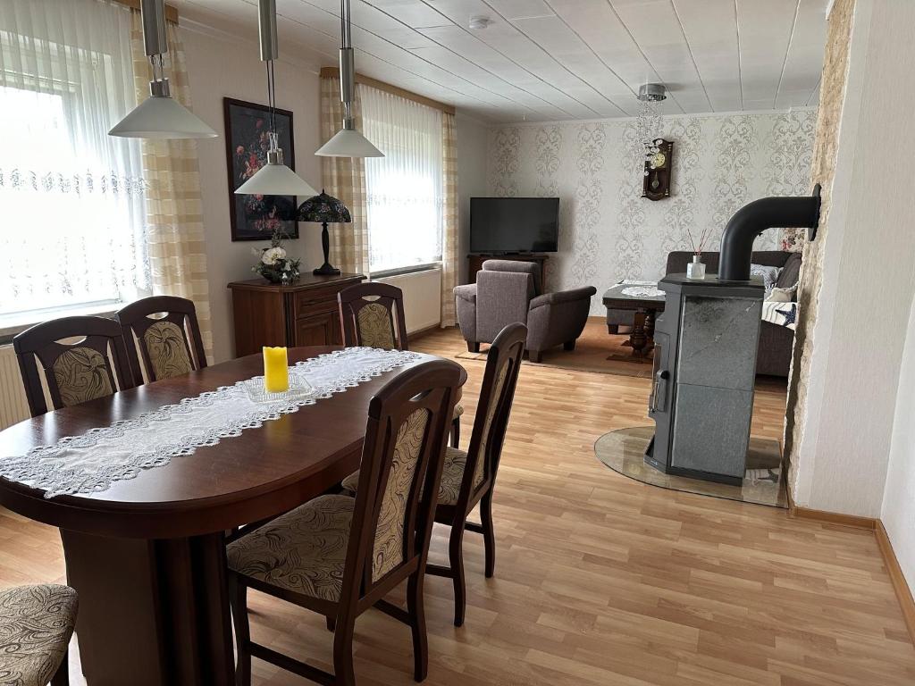 a dining room with a table and a living room at Ferienhaus - a90588 in Grevesmühlen
