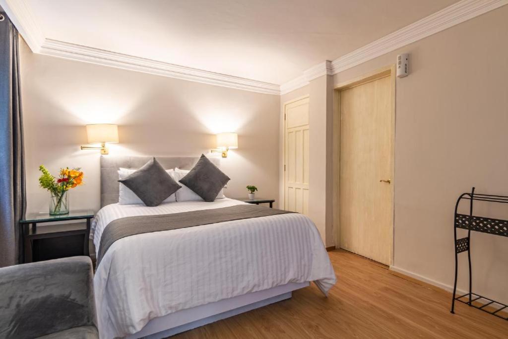 Cama o camas de una habitación en Suites Newton